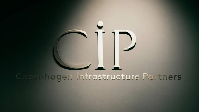Copenhagen Infrastructure Partners logo displayed on an interior office wall