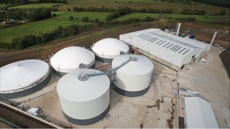 Aerial view of an agricultural biogas plant with anaerobic digestion tanks