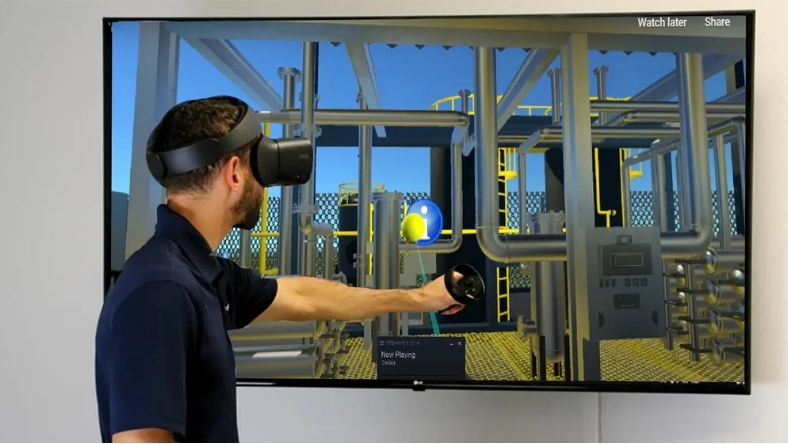 Engineer interacting with a virtual industrial plant simulation using VR