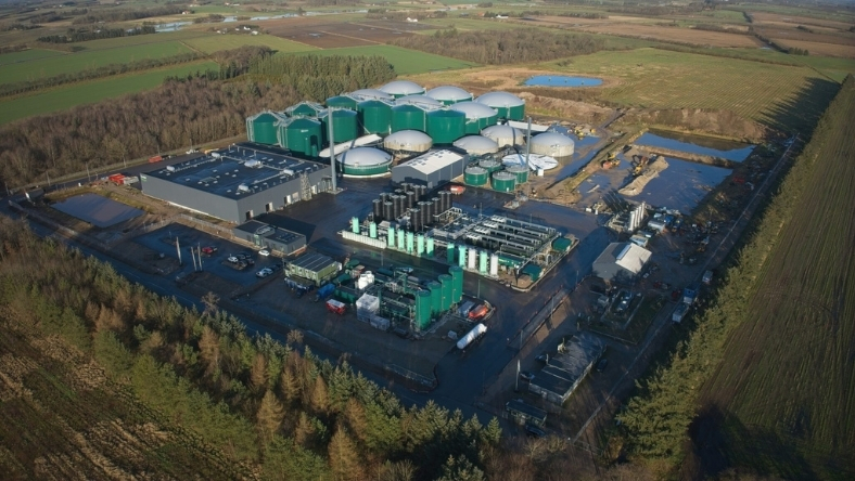 Aerial view of a large biomethane plant with digesters and grid connection