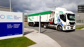 CNG-powered Iveco truck at the Gas Networks Ireland Networks Services Centre entrance with branded signage